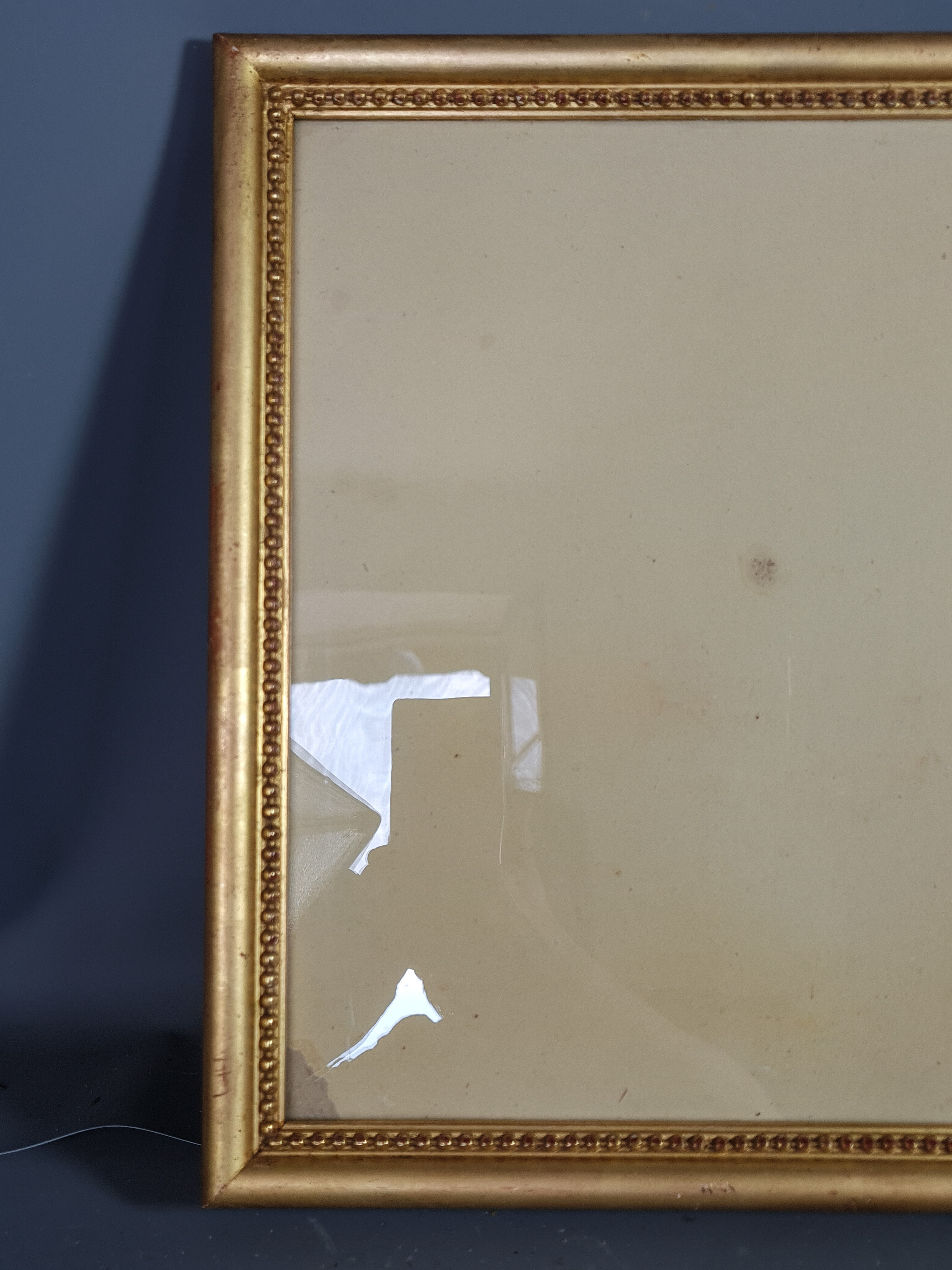 Old frame beaded decoration, gilded stucco wood