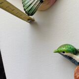 Two exotic birds in slip to hang