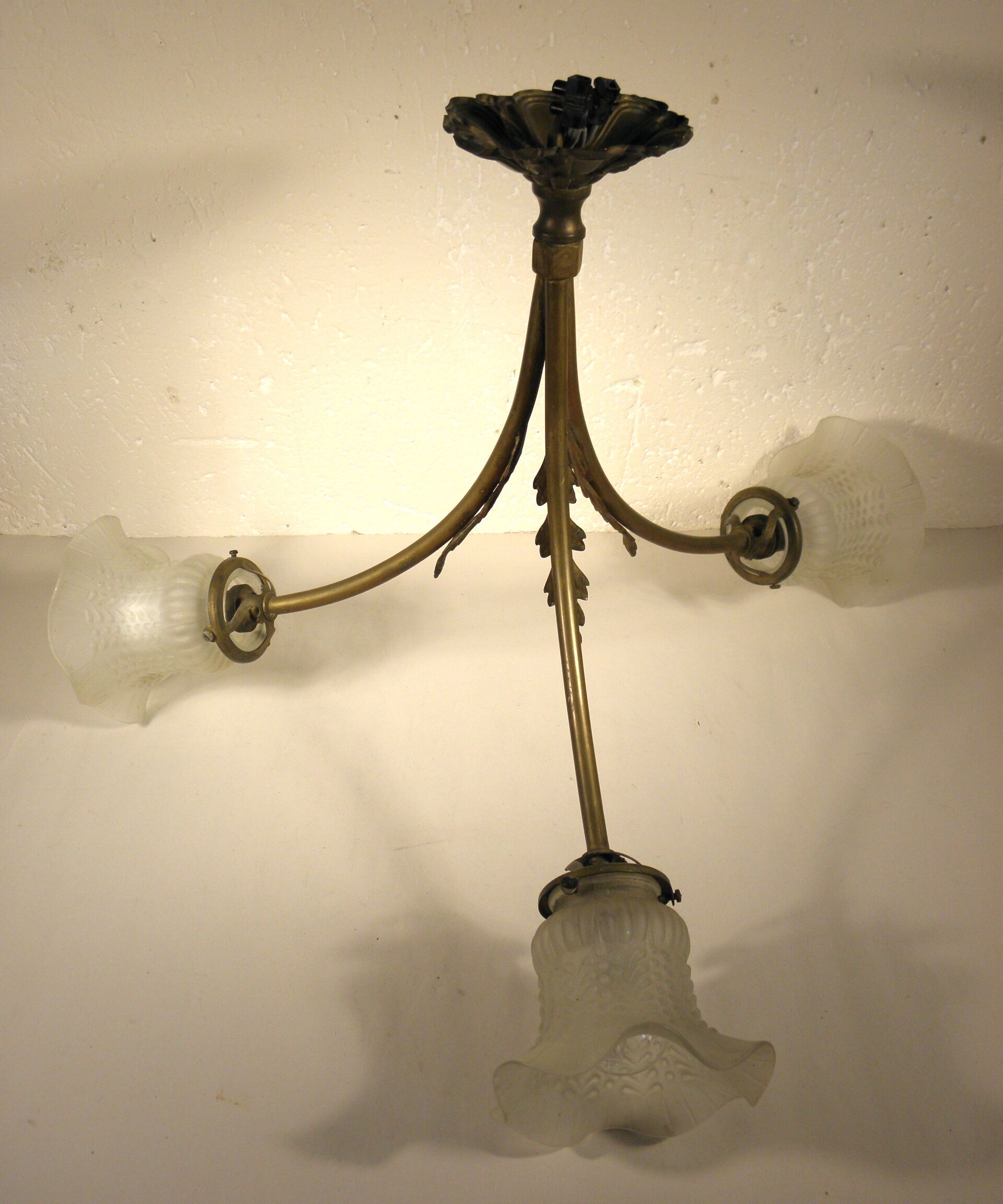 Three-spoke brass and glass chandelier