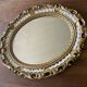 Kitsch 70s gold resin oval mirror