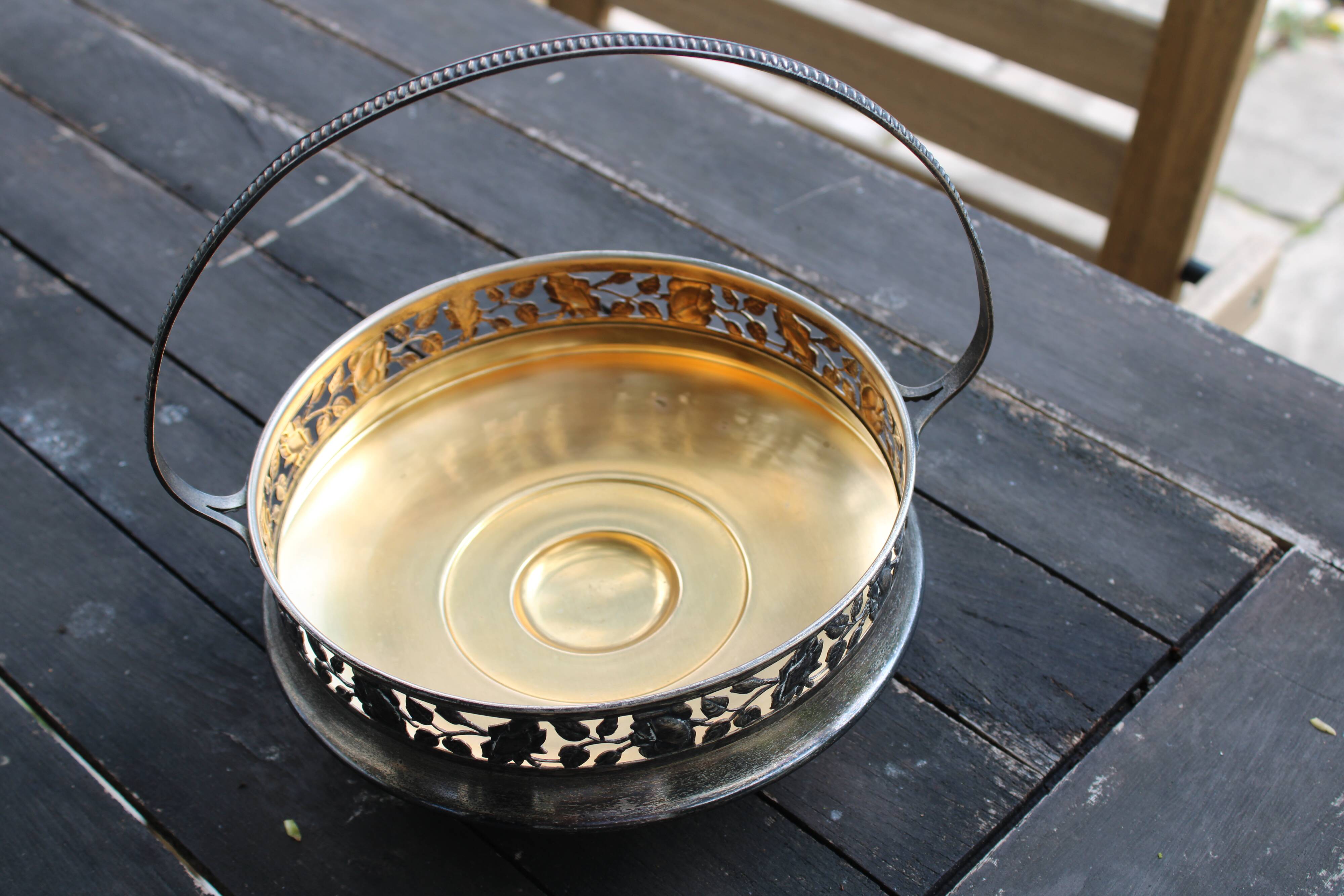 Worked metal fruit basket and glass