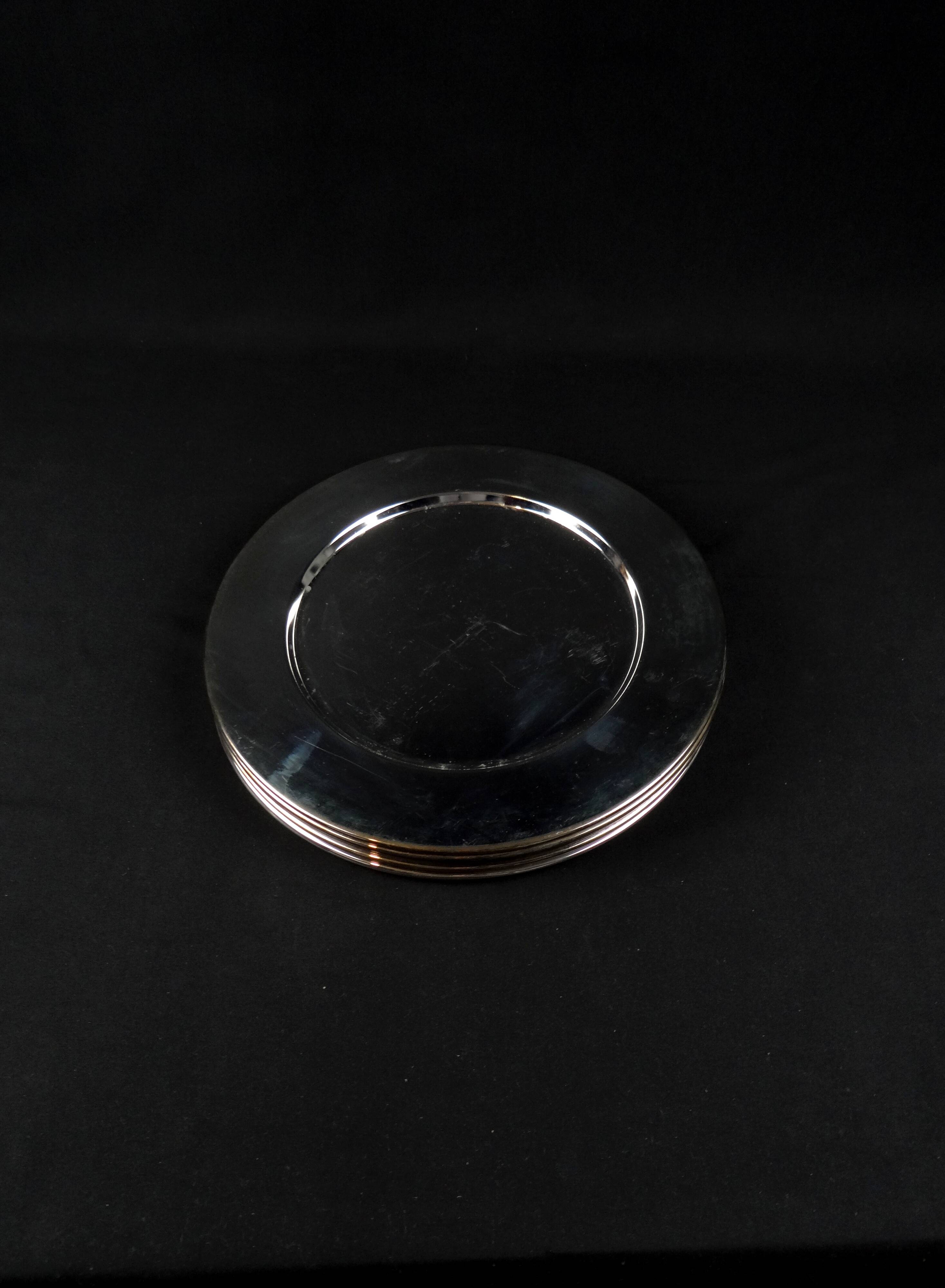 Set of 8 round serving platters or saucers in vintage stainless steel
