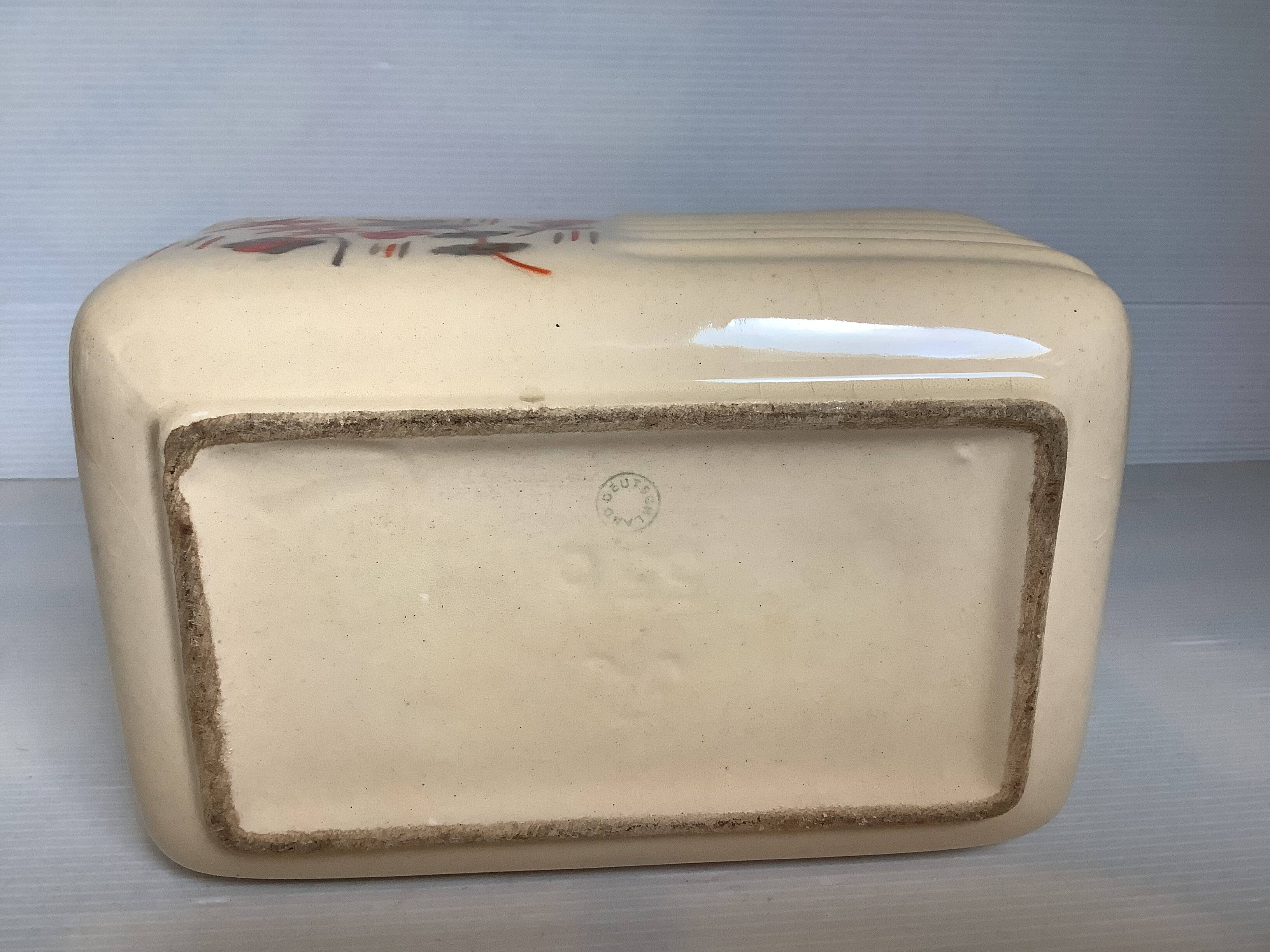 Art Deco planter with stencilled flower motif