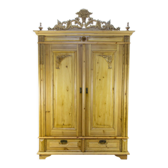 Baltic pine two-door armoire with carved crown, ca. 1920s