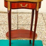 Louis XVI period pedestal table, in solid mahogany and veneer, and in gilded bronze.