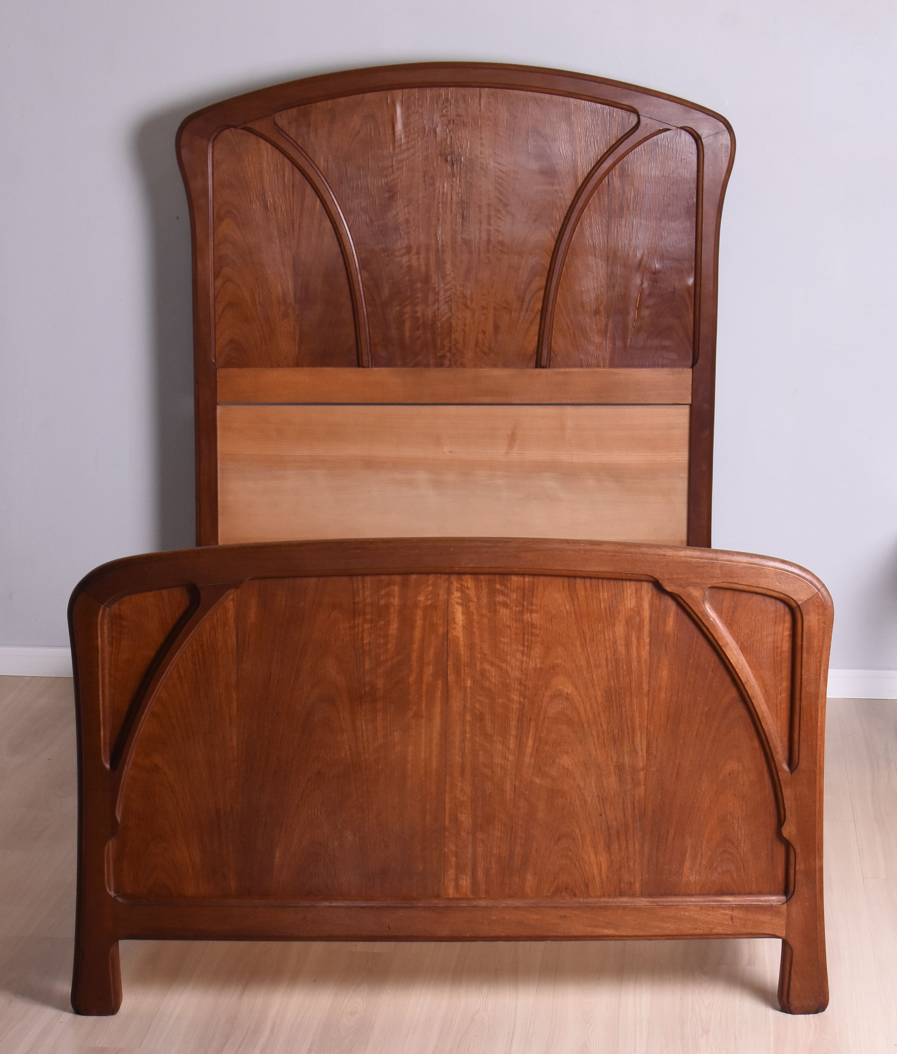 Wooden bed, early 20th century.