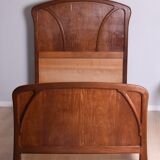 Wooden bed, early 20th century.