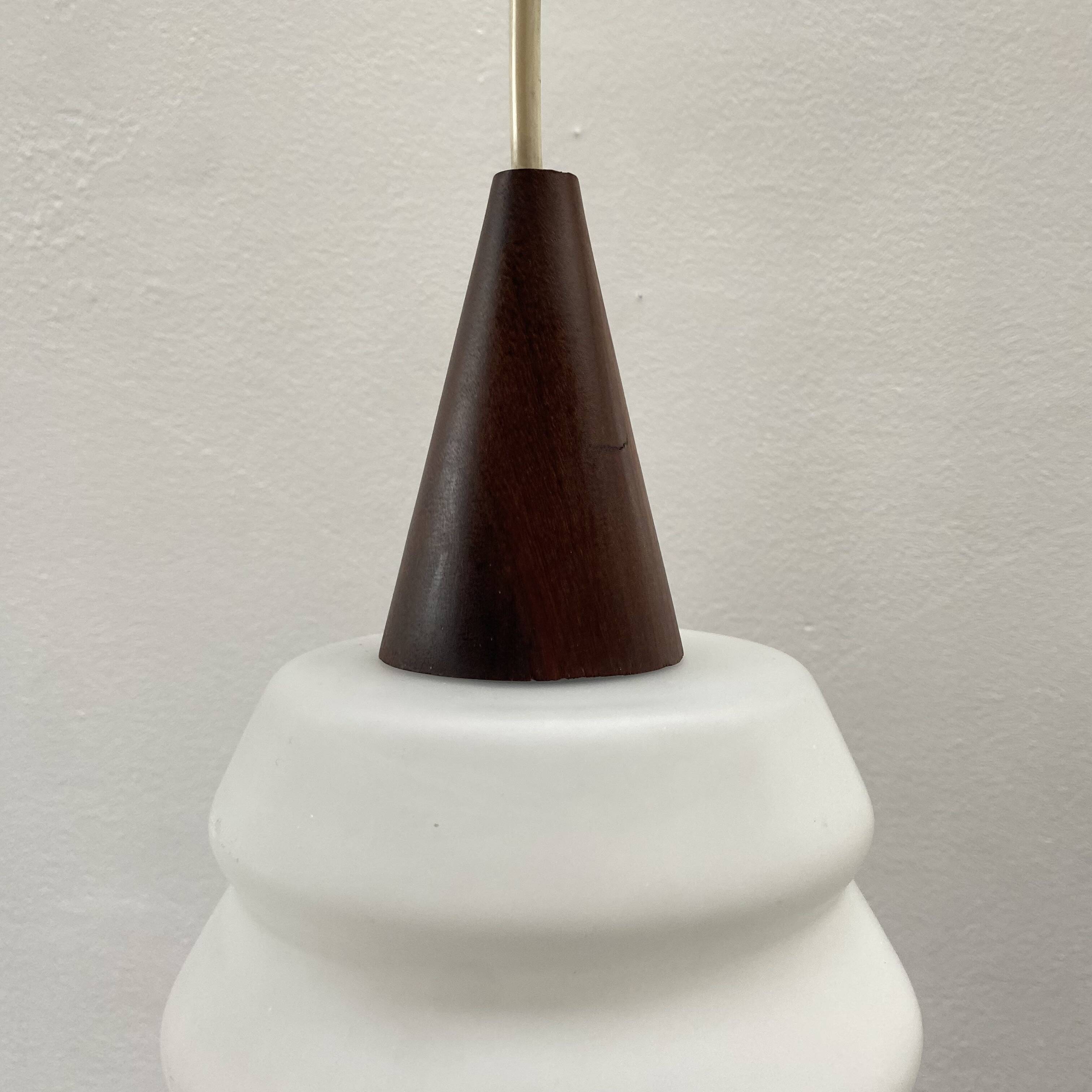 Teak and opaline pendant light from the 60s by Louis Kalff for Philips
