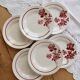 6 vintage dessert plates Moulin des Loups with burgundy floral decoration.