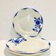 4 white porcelain plates with blue flowers