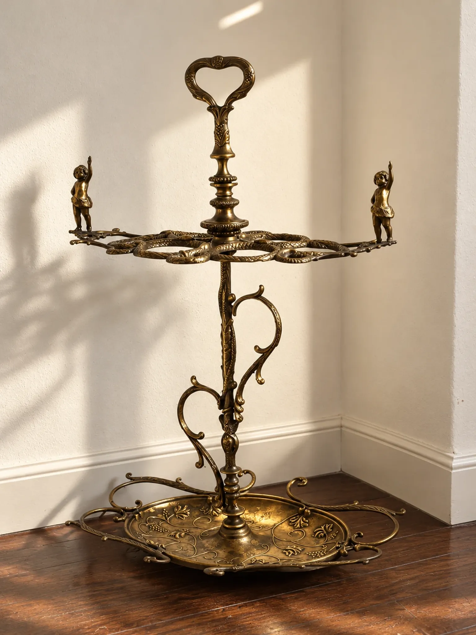 Italian brass umbrella stand, Art Nouveau style, with putti.