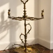 Italian brass umbrella stand, Art Nouveau style, with putti.