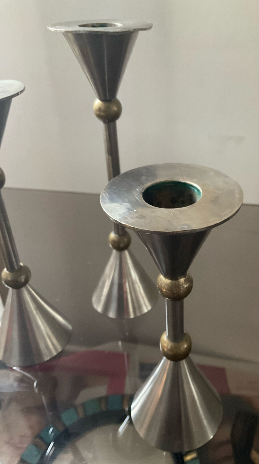 Trio of vintage metal and bronze candle holders