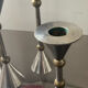 Trio of vintage metal and bronze candle holders