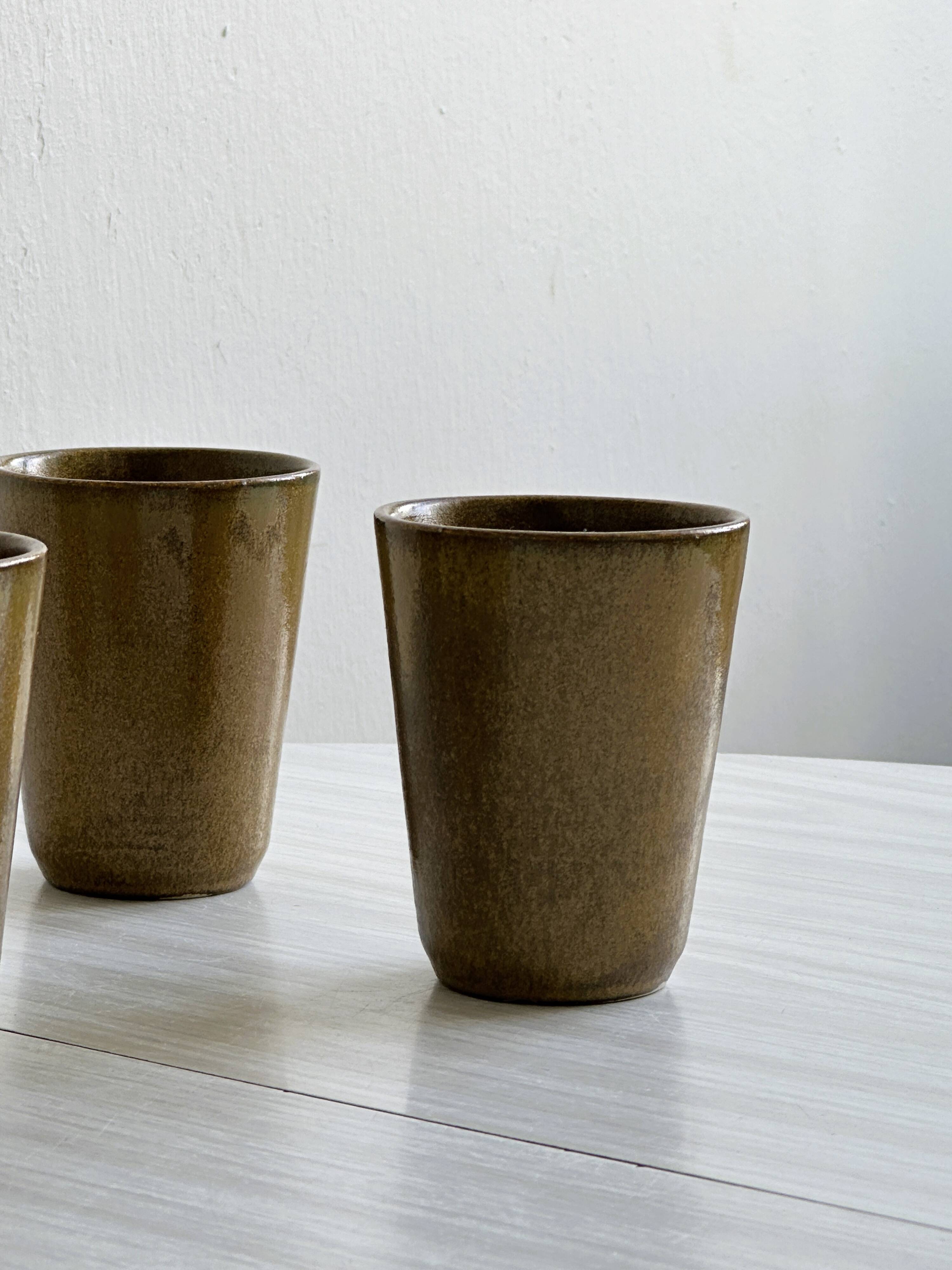 6 Digoin ceramic mugs.