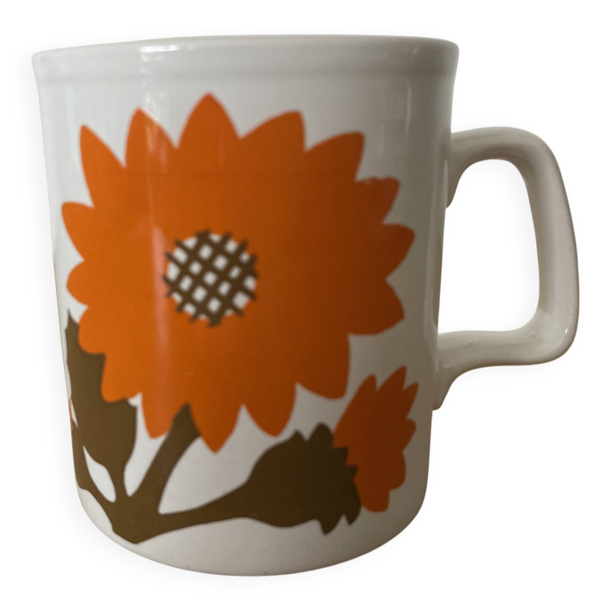 Staffordshire mug made in England with an orange floral motif.