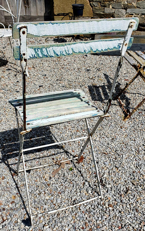 Wooden slatted garden chair with wooden slats and iron foot