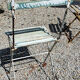 Wooden slatted garden chair with wooden slats and iron foot