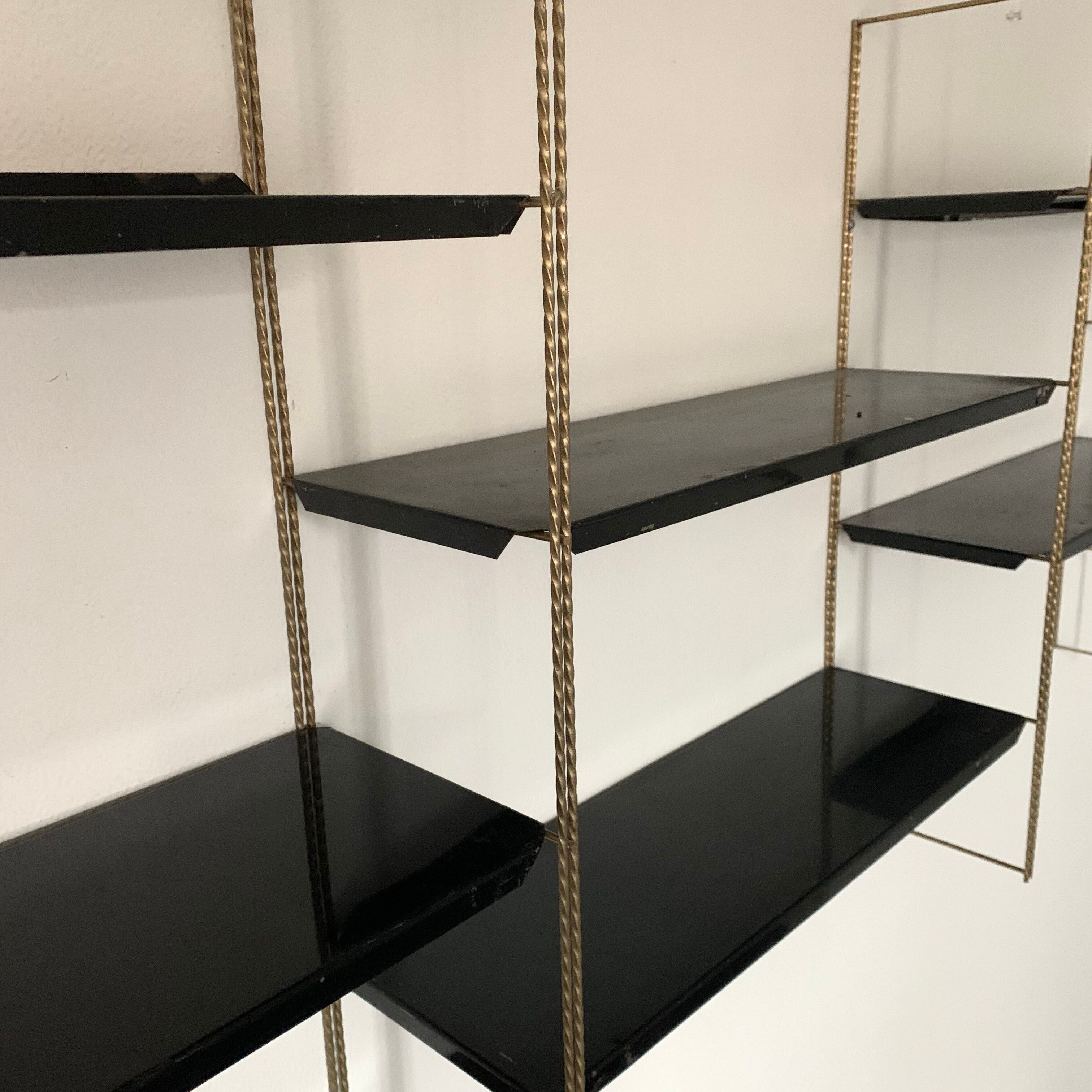 Vintage wall shelves in gold and black metal