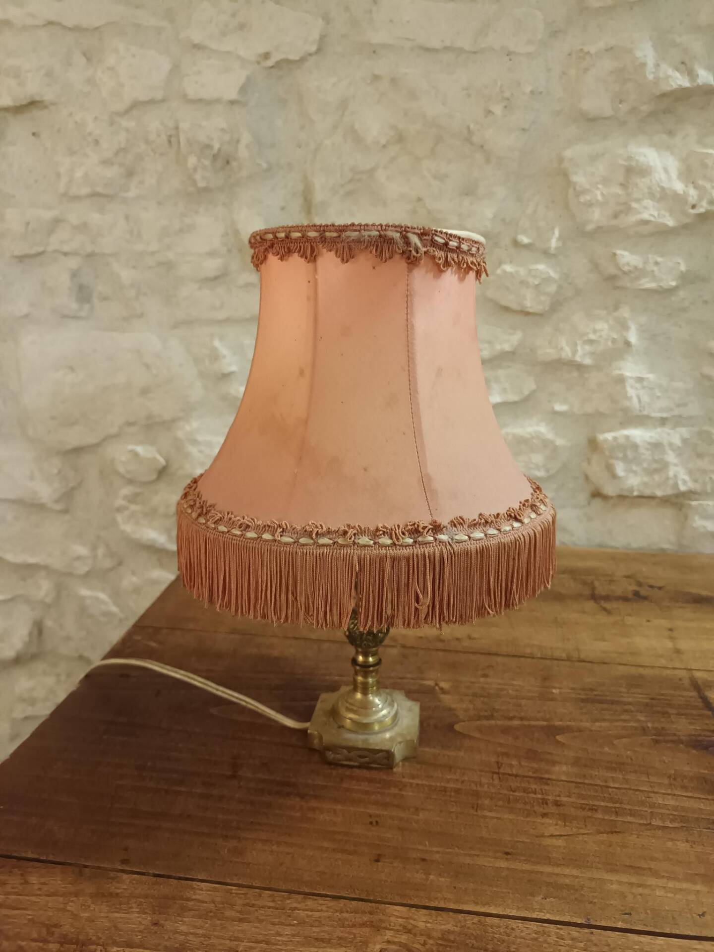 Vintage lamp, pink fringed pagoda shade and brass base.