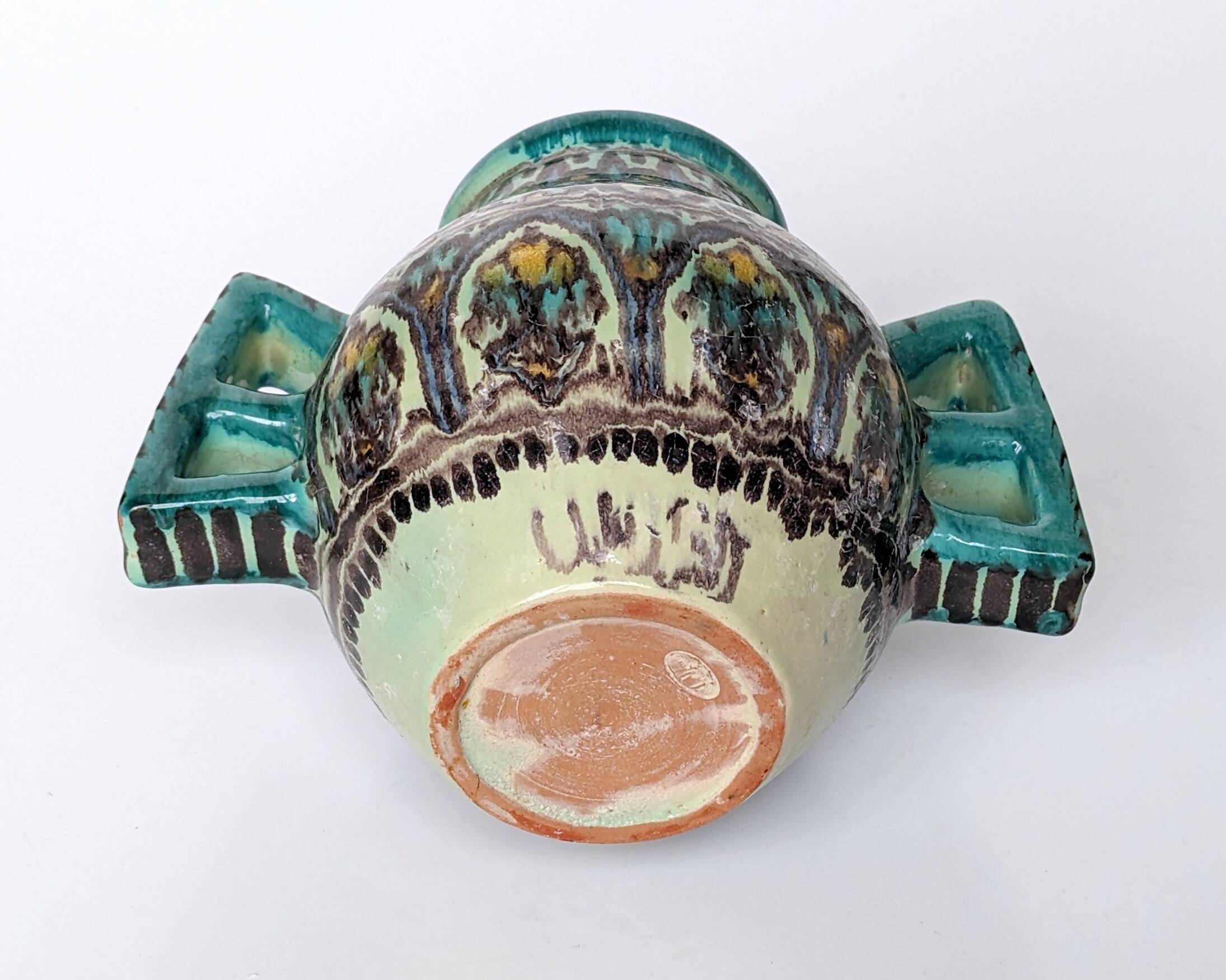 Polychrome ceramic vase in flowing enamel from Nabeul with mihrab decoration.