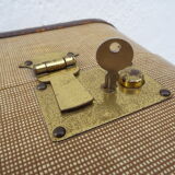 1930s Oshkosh suitcase with bakelite hangers