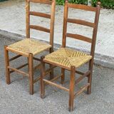 2 solid wood and straw chairs