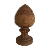 Carved wooden pine cone