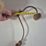 Vintage 1960s wall coat rack in wood and metal.