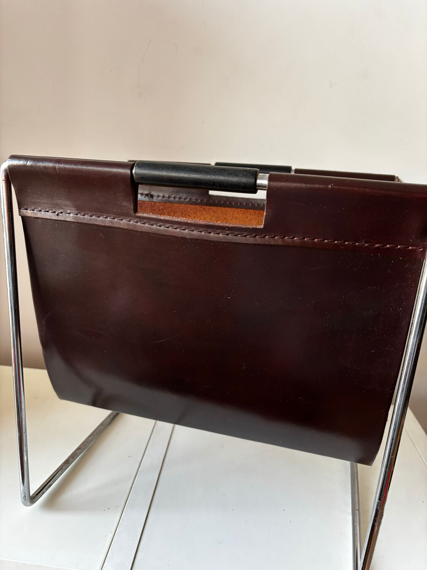 Leather and chrome magazine rack Brabantia