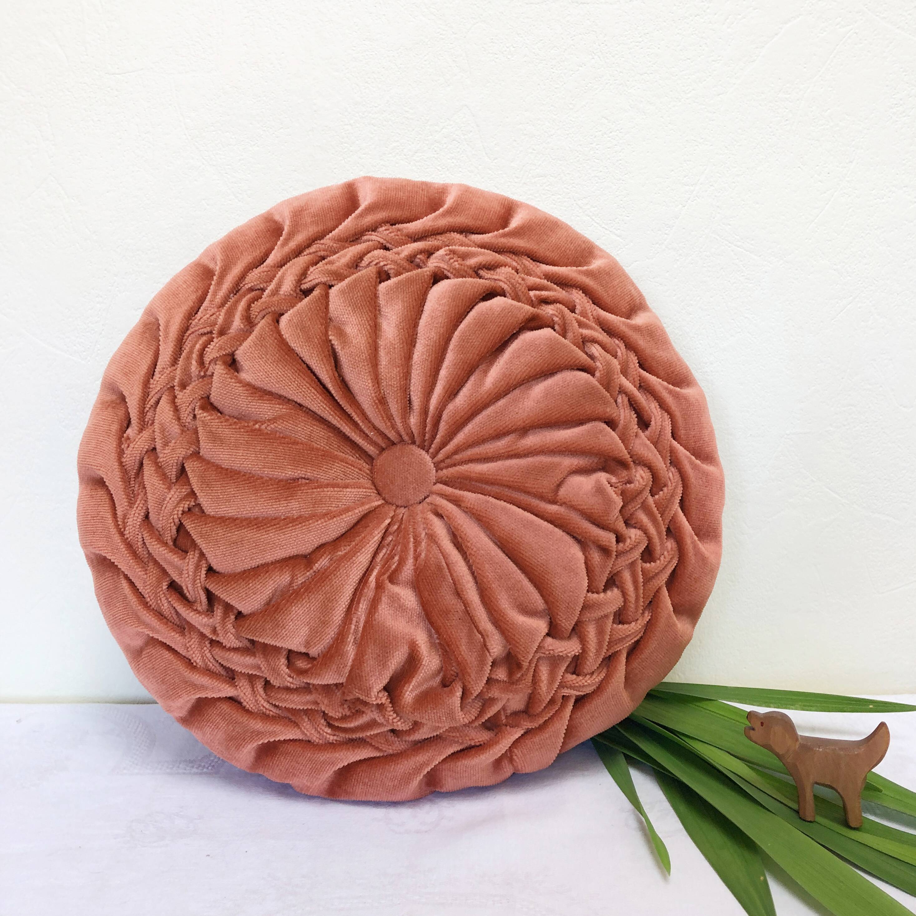 Round orange velvet cushion