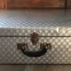 Large vintage suitcase in light metal