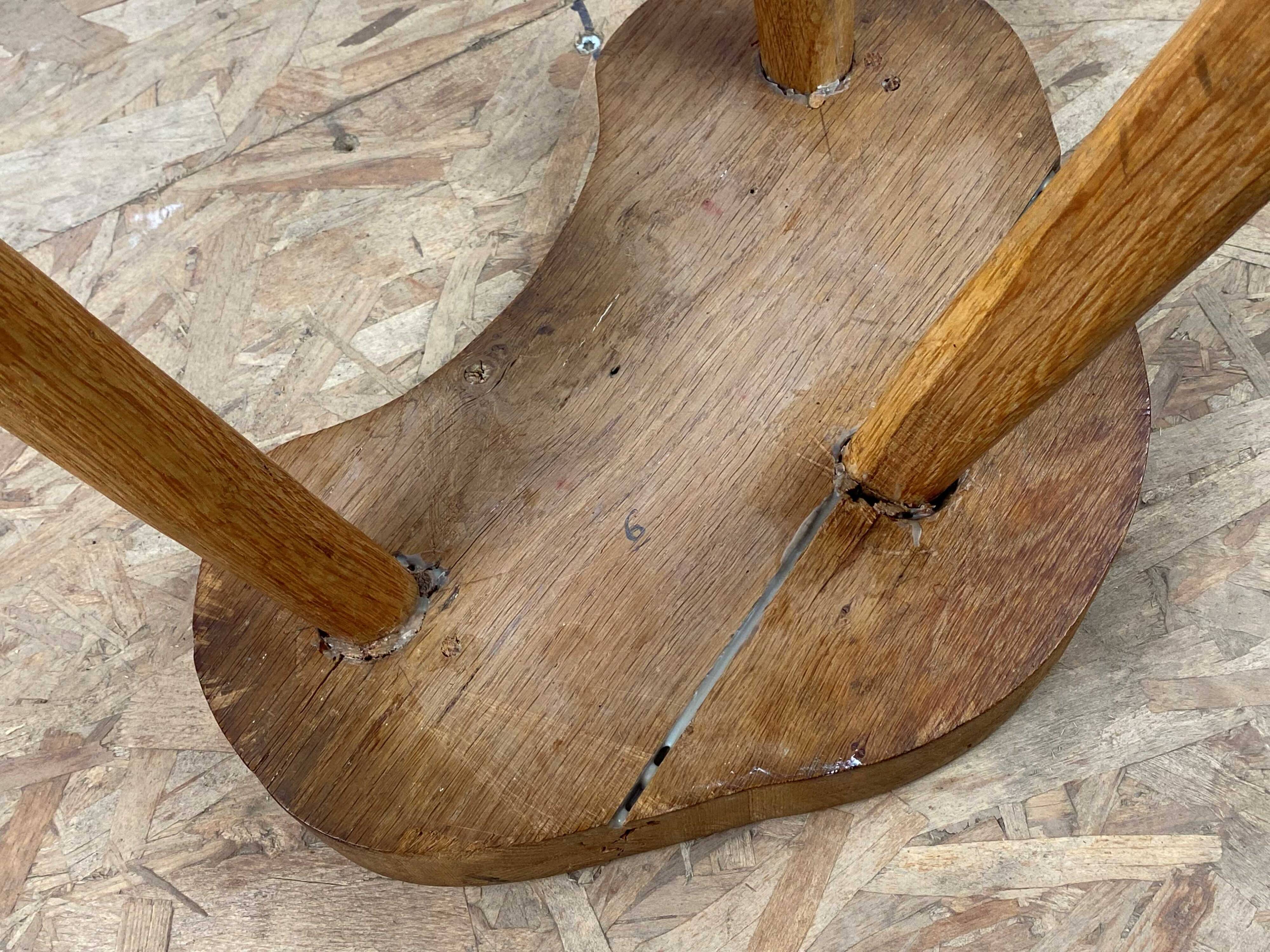 Set of 6 brutalist solid oak tripod farm stools from the 1950s