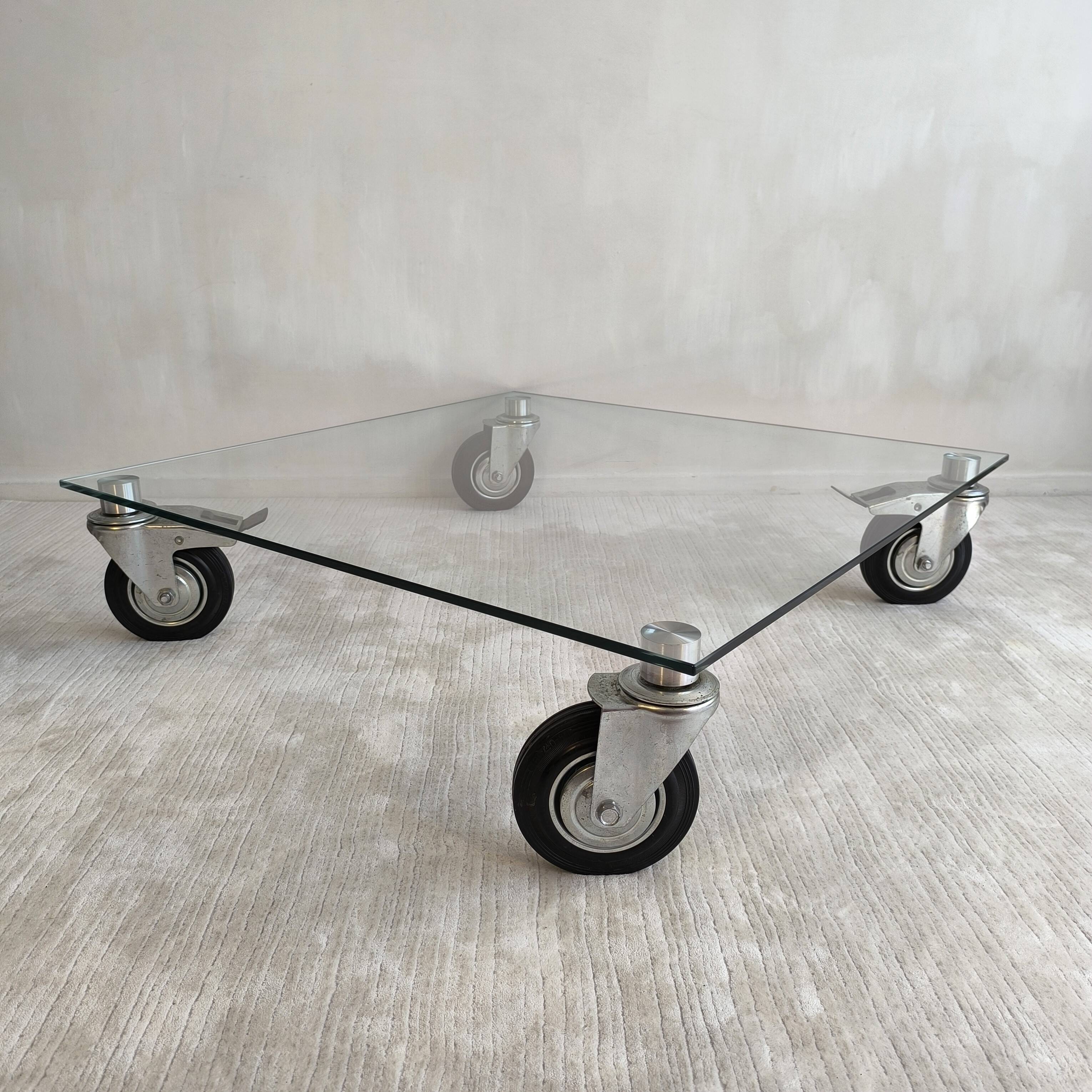 Beautiful designer glass coffee table on wheels