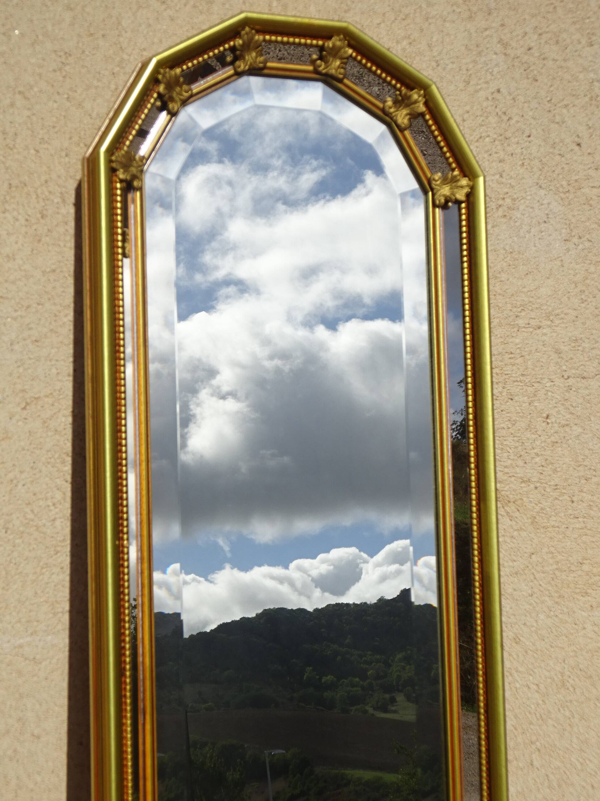 Hallway mirror, gilded frame, curtains and fleur-de-lis