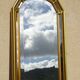 Hallway mirror, gilded frame, curtains and fleur-de-lis