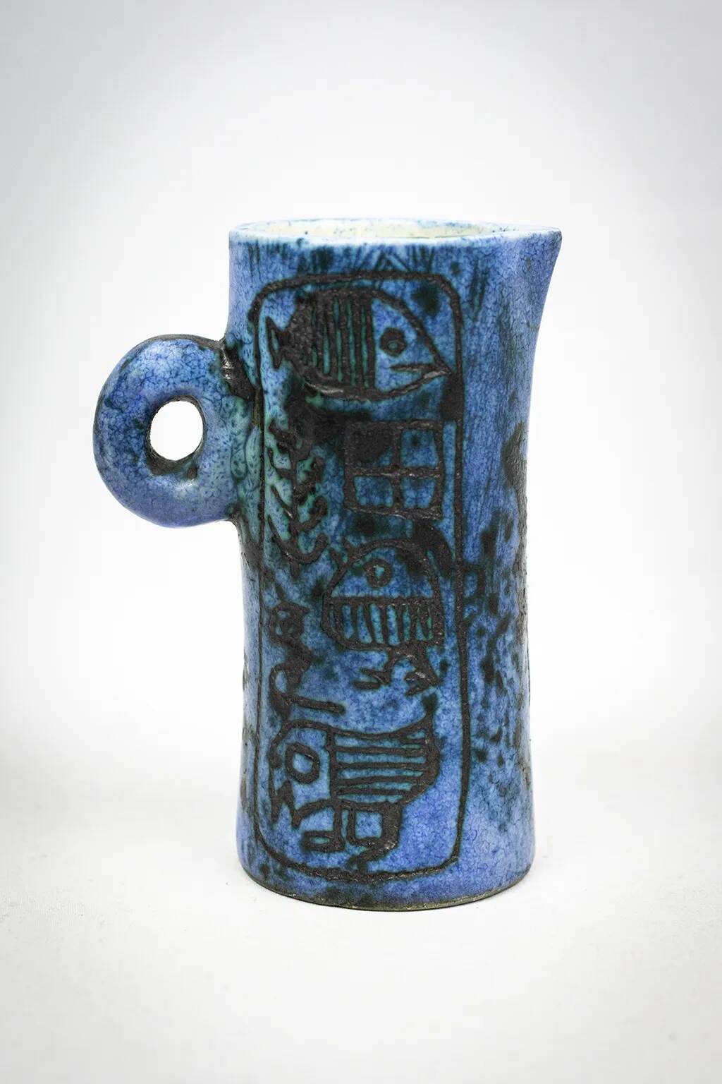 Small jug by Jacques Blin in blue ceramic with engraved animal decoration.