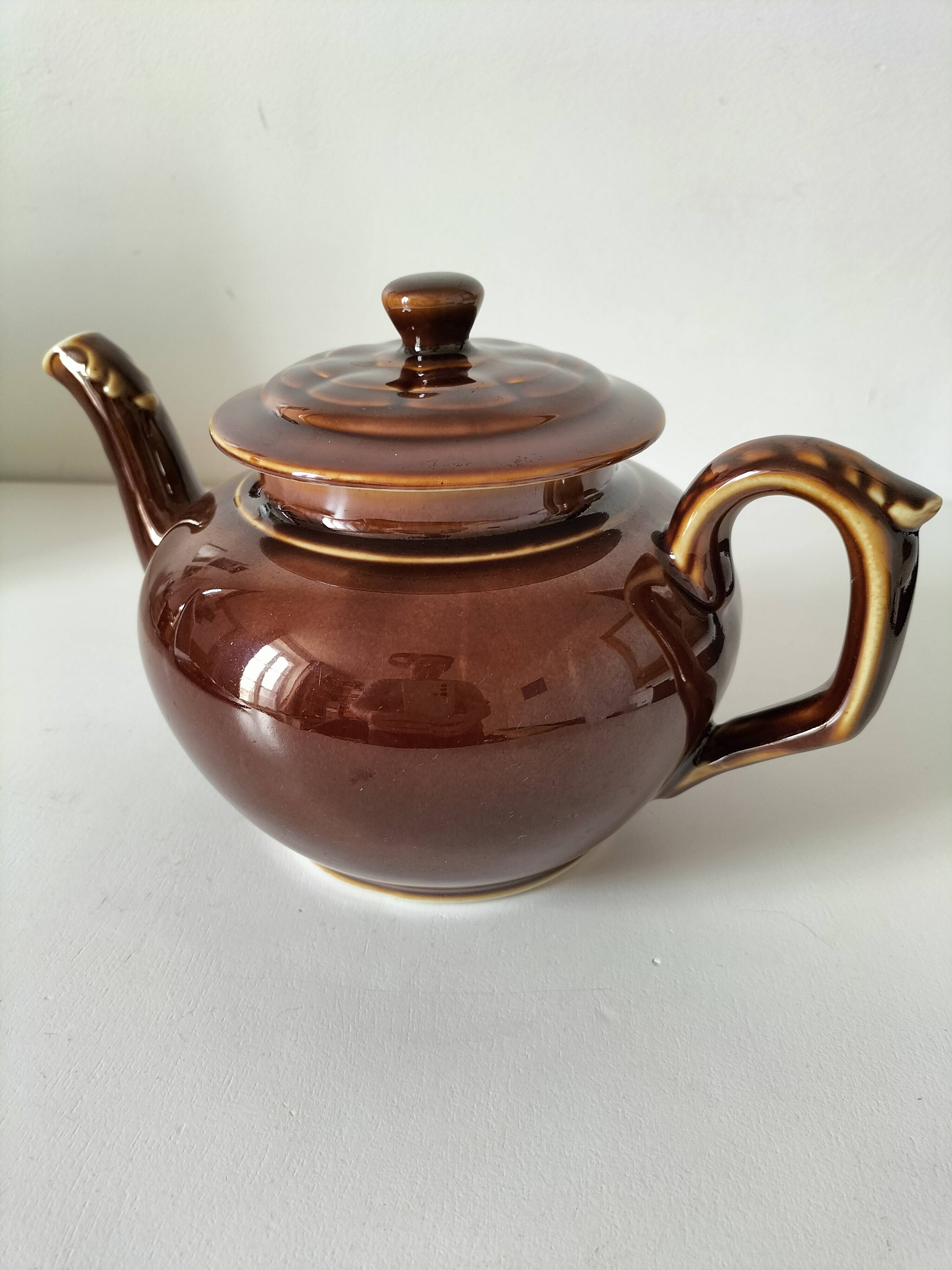 Vintage brown glazed earthenware teapot, mid-century sculptural decor.