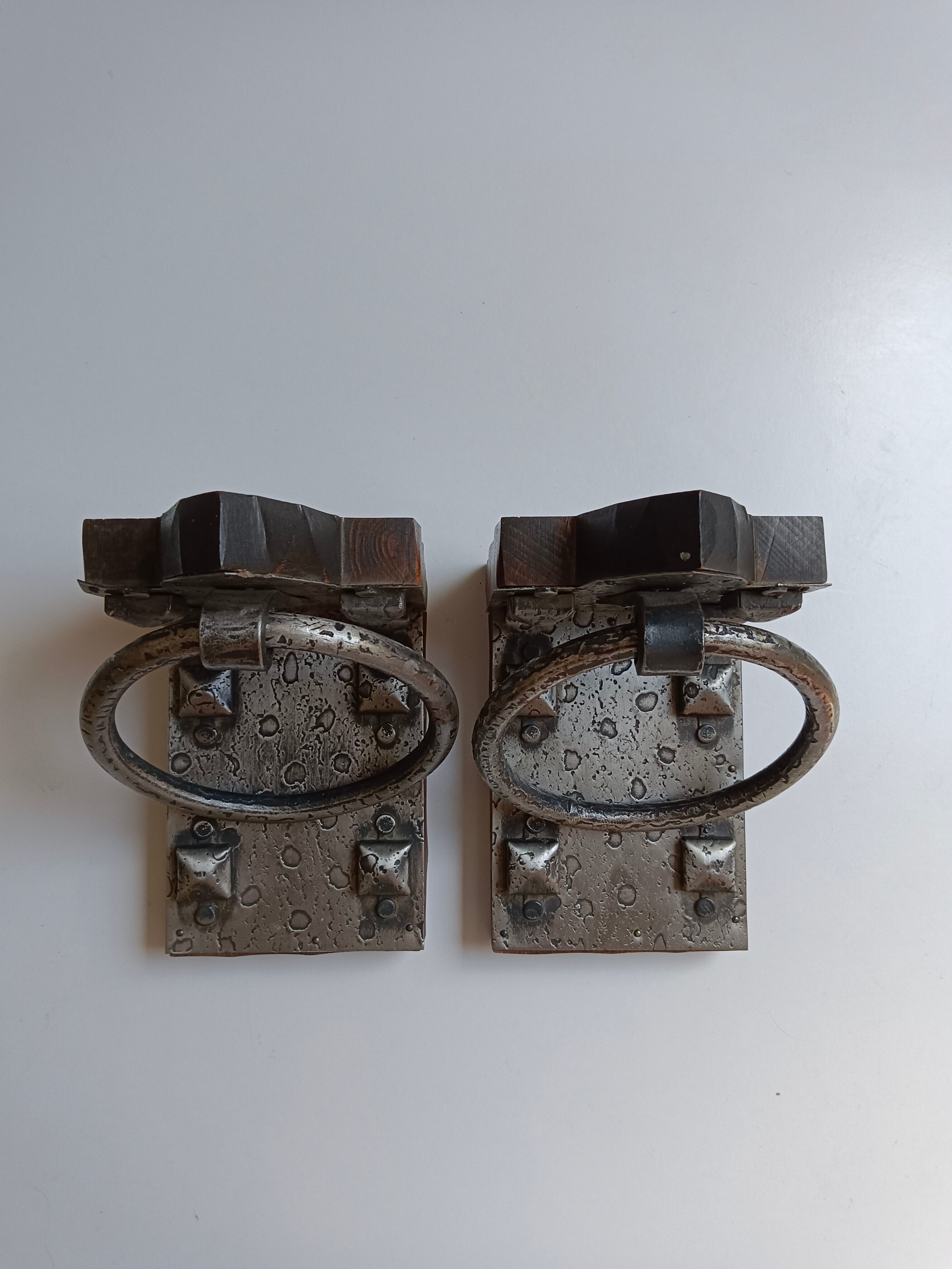 Medieval-style bookends, antique door handle.