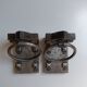 Medieval-style bookends, antique door handle.