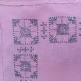 Large vintage linen tablecloth embroidered in pink and 12 matching napkins.