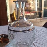 Blown glass decanter, engraved and chiselled. Made in France.