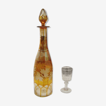 Vintage glass decanter with vine leaf patterns