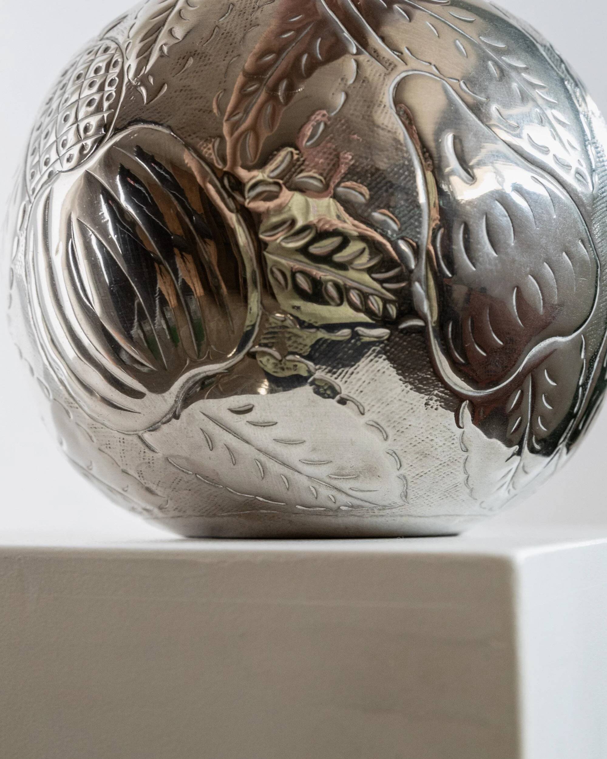 Vintage Italian vase in nickel-plated brass from the 1960s, hand-hammered relief of fruits and leaves.