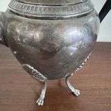 Empire style silver-plated verseuse, resting on three sculpted feet.