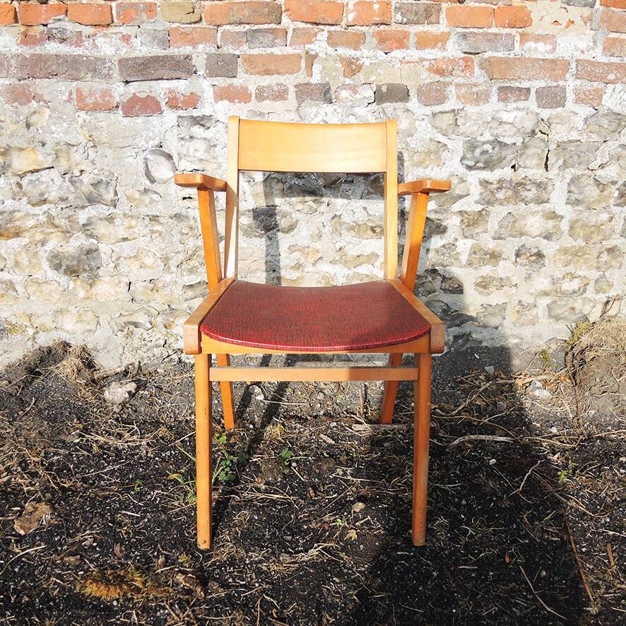 Old wooden and red leatherette bridge chair