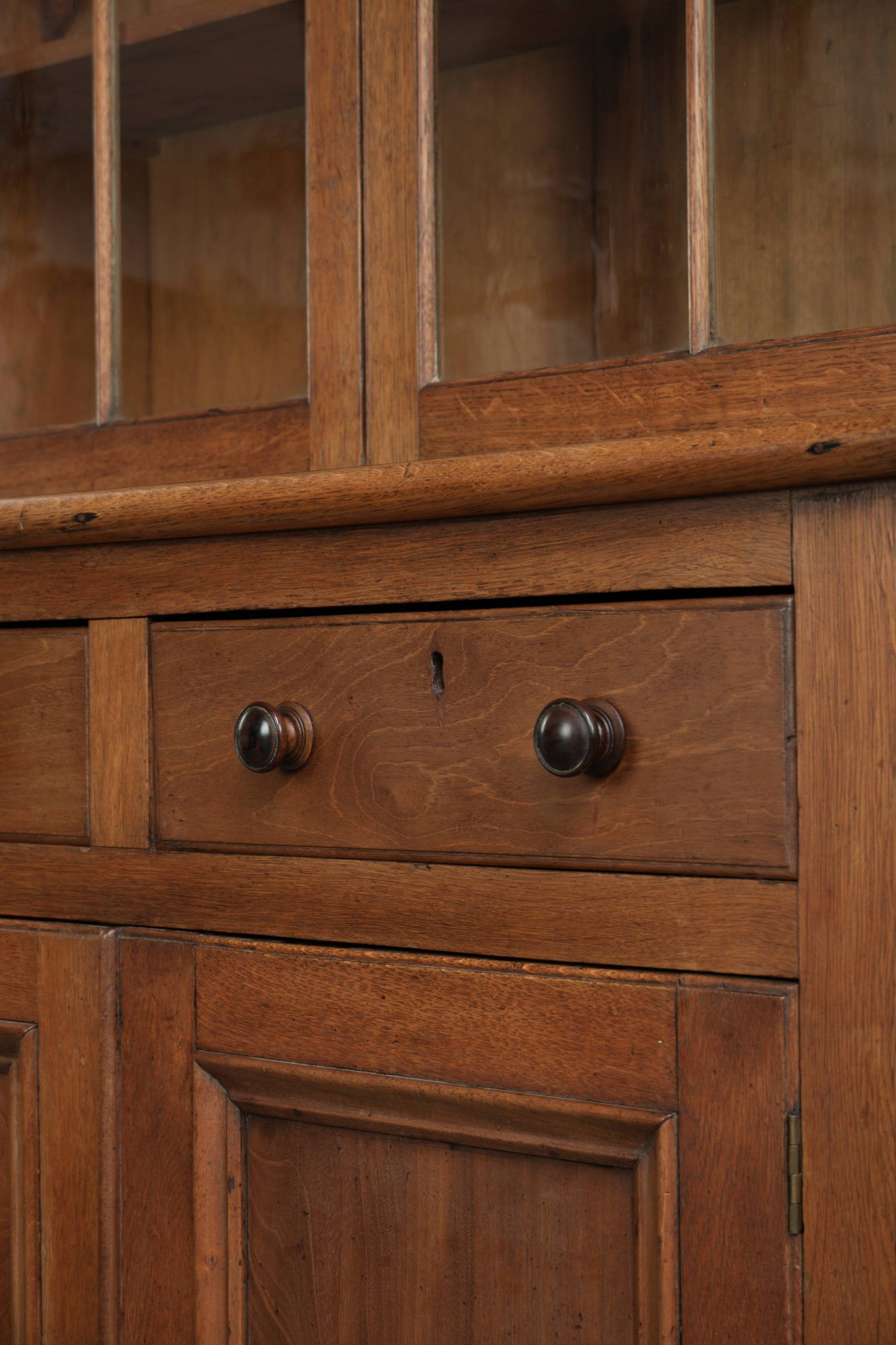 Antique English oak buffet/bookcase from 19th century with original glass