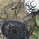 3 ornate wrought iron garden armchairs
