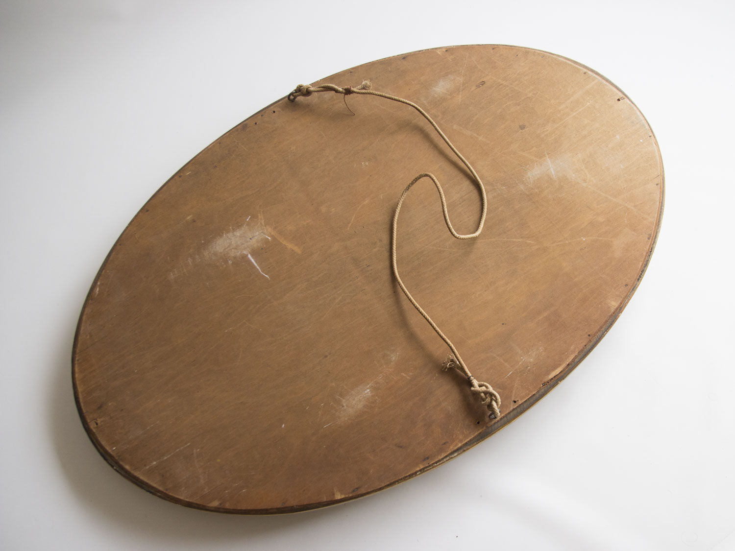 Golden oval mirror
