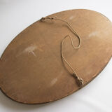 Golden oval mirror